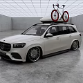 White Mercedes SUV With Red Bicycles Mounted On Roof Rack In Modern Indoor Garage