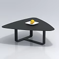 Modern Black Triangular Coffee Table With White Plate And Yellow Fruit