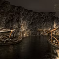Cultural Center Interior With Rock Textured Walls Wooden Railings Water Floor And Vintage Tools