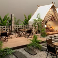 Outdoor Cafe With Tent Structure Wooden Deck Tables Chairs And Green Plants