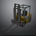 Yellow Industrial Forklift With Long Metal Forks And Driver Cabin