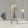 Modern Minimalist Floor Lamp with Circular Shade Tripod Stand and Moon Decor in Interior