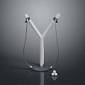 Y Shaped Slingshot With White Body Black Elastic Bands Base And Marbles