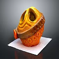 Animal Themed Decorative Object in Orange with Circular Holes on White Paper Background
