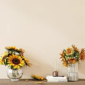 Clear Glass Vases With Sunflowers On Tabletop Beige Wall Background And Books