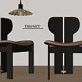 Black THONET Dining Chairs With Brown Leather Seat And Unique Back Design On Wooden Floor