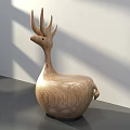 Wooden Deer Shaped Single Chair On Gray Table With White Wall Background And Sunlight Shadows