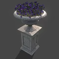 Purple Flowering Plants In Decorative Stone Planter On Pedestal Base