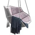 Woven Hanging Chair With Pink Cushion And Dark Blue Tassel Blanket