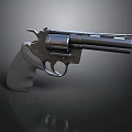 Metallic Revolver Handgun With Gray Grip And Dark Background Reflection