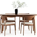 Modern Wooden Dining Table With Four Chairs Light Cushions Black Vase And Green Plants