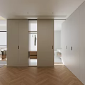 Modern Walk in Closet Interior With White Cabinets Open Hanging Area And Herringbone Wood Floor