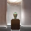 Ceramic Vessel Display On Wooden Stand With Gray Walls And Decorative Lines In Gallery
