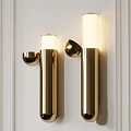Elegant Gold Wall Lamps With Cylindrical Design And White Shade Mounted On White Wall