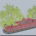 Vibrant Red Shrubs In Landscaped Garden Bed With Green Trees And Stone Edging