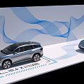 Two ID.6 X Cars Displayed with Blue Wavy Lines Background Design