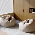 Two Beige Fabric Bean Bag Chairs in Cozy Room with Wooden Wall and Soft Rug