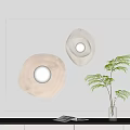 Two Modern Beige Irregular Shape Wall Lamps Illuminated With Green Plant Decor 3d model