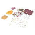 Assorted Colorful Food Ingredients Including Seeds Grains And Petals On White