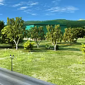 Beautiful Garden Landscape With Green Lawn Trees Mountain View Blue Sky And White Clouds