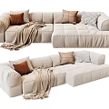 Plush Beige L shaped Sectional Sofa With Brown Checkered Pillows And Throw Blanket