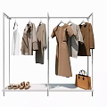 Metal Clothing Rack Displaying Coats Dresses Shirts With Shoes And Handbag