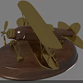 Decorative Ornament Set With Golden Biplane Model On Vintage Wooden Base