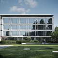 Modern Glass Facade Office Building With Green Lawn Trees And Outdoor Space