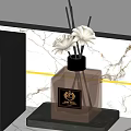 Elegant Fragrance Bottle With White Flowers On Black Base And Marble Background