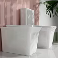 Three White Toilets in Modern Bathroom with Pink Striped Wall and Green Palm Leaves