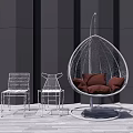 Stylish Rattan Hanging Chair With Brown Cushions And White Metal Chairs On Wooden Patio