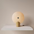 Minimalist Modern Beige Round Fabric Table Lamp With Wooden Base On White Table