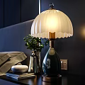 Stylish Single Sofa in Bedroom with White Shade Blue Base Lamp Green Plant and Books