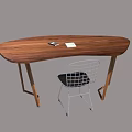 Wooden Oval Shaped Desk With Black Object Notebook And Metal Frame Chair