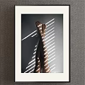 Minimalist Figure Painting Featuring Crossed Legs White Light Stripes and White Frame on Grey Wall