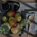 Assorted Fresh Pineapples Pear And Mango On Gray Cloth Plate Wooden Table