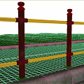 Black Metal Road Guardrail Along Sidewalk With Green Grass And Yellow Line