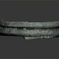 Ancient Bronze Bracelet with Intricate Carved Surface Circular Design on Dark Background 3d model