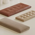 Three Different Colored Decorative Cushions With Diamond Stitching Button Tufted And Smooth Surfaces