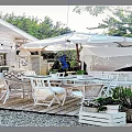 Charming Tropical Beach Cabin Scenery With Lush Palm Trees And Comfortable Seaside Outdoor Lounge