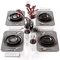 Elegant Dinnerware Set With Black Plates Bowls Cutlery Wine Glasses Napkins And Red Berries Vase