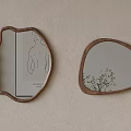 Irregular Shaped Wooden Framed Mirrors With Hand Drawn Art And Reflected Plant On Wall