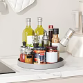 Condiment Bottles Organized On Rotating Tray With Various Seasonings In Modern Kitchen