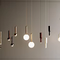 Modern Pendant Lights Design With Hanging Spherical and Cylindrical Gold Black White Metallic Illuminated Fixtures