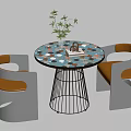 Modern Round Negotiation Table with Colorful Tabletop Metal Legs White Orange Chairs and Small Plant