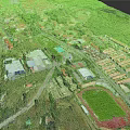 Modern Town Aerial View With Green Spaces Buildings And Sports Field