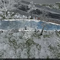 Snowy Garden Landscape With Bare Trees And Snow Covered Hills Under Cloudy Sky