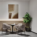 Modern Office Lounge Area With Round Tables Chairs Wall Artwork Green Plant And Ceiling Lights
