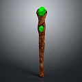 Detailed Carved Brown Wooden Staff With Two Green Gemstones On Top And Middle