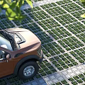 Orange Pickup Truck Parked On Grass Paved Area Near Trees